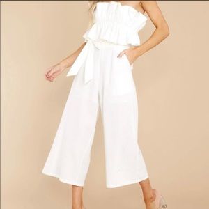 Boutique style white jumper with ruffled top